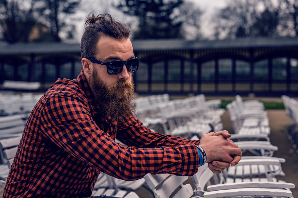 man in orange and black plaid long sleeve shirt with sunglasses preview